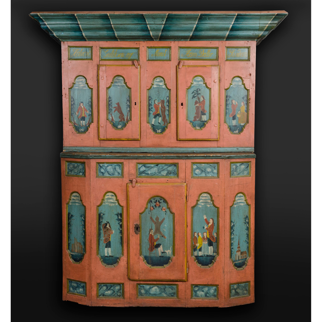 A two-level orange cabinet with two rows of five teal panels portraying the story.