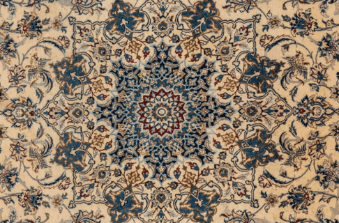 An intricate woven Persian carpet featuring patterns in blue with red and gold detailing on a light-coloured background.