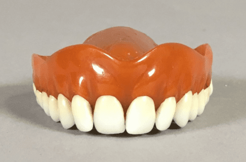A set of upper dentures.