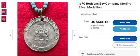 Screen shot showing the front of a fake coin that uses the coat of arms and looks pretty authentic.