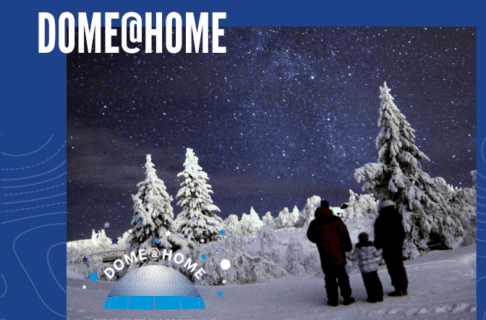 Photograph on a blue background. Two adults and a child wearing winter gear stand in a snowy clearing looking up at the night sky. In the bottom left corner is the Dome@Home logo. Text along the top reads, "DOME@HOME"