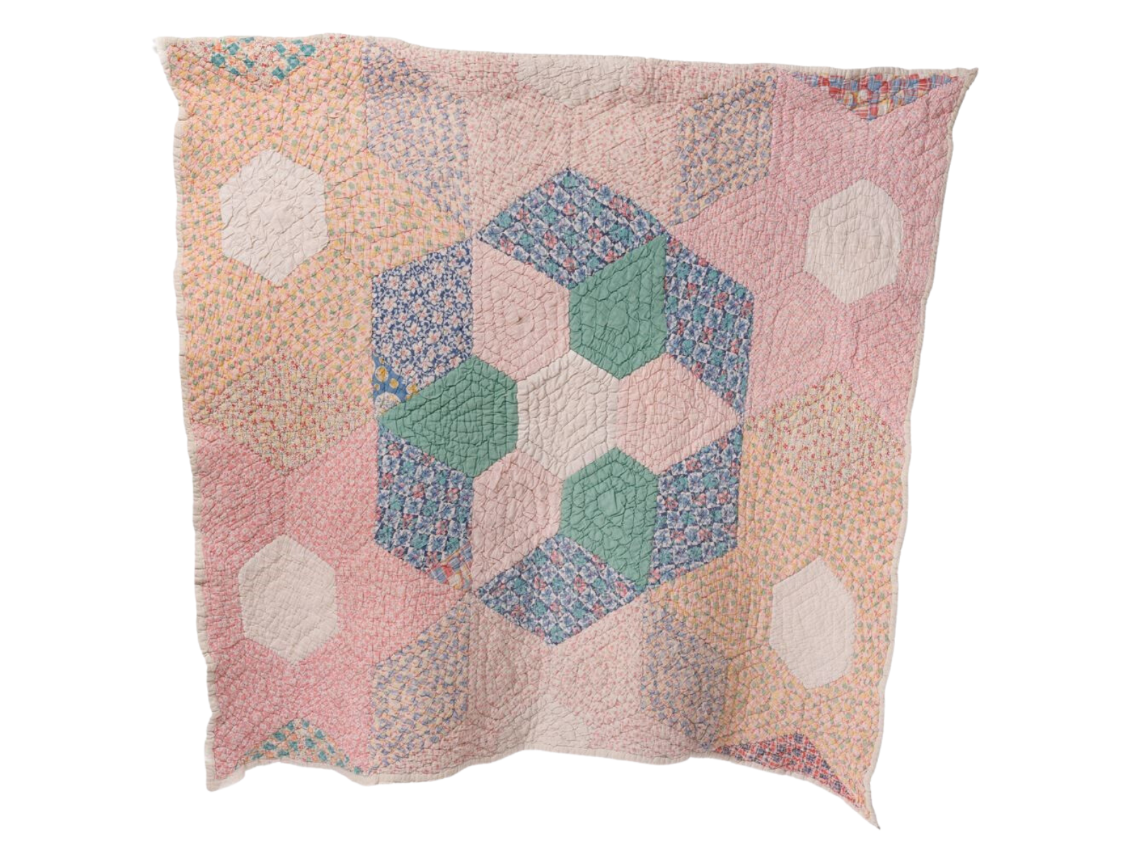 A quilt stitched of pastel pink, orange, and cream fabric with an accent portion in the middle in blues and greens.