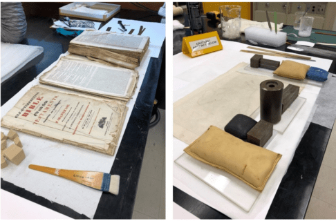 Two photos side-by-side. On the left, large, loose pages of the Brown's Bible are in three stacks on a table next to a fine bush. On the right, padded weights are placed around the edges of a page lying on a table to flatten it.