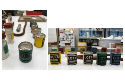 Two photos side-by-side. On the left, looking down at an angle on one of the cardboard canisters from the chemistry set with its metal pop-off lid. On the right, five of the cardboard canisters in a row. The canisters have “Lott’s Chemistry” written on the sides.