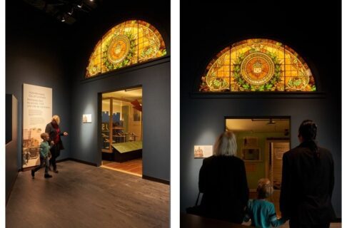 Two photos side-by-side. On the left, an adult and child walk hand in hand towards a doorway leading into the Winnipeg 1920 Cityscape. Above the doorway is a large half-circle stained glass window. On the right, two adults with a child between them stand facing a doorway leading into the Winnipeg 1920 Cityscape, looking up at the half-circle stained glass window above the doorway.