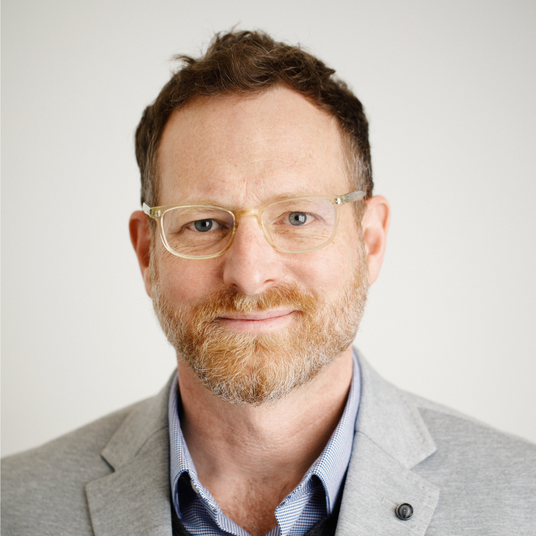 Formal headshot of Dr. Roland Sawatzky smiling at the camera.