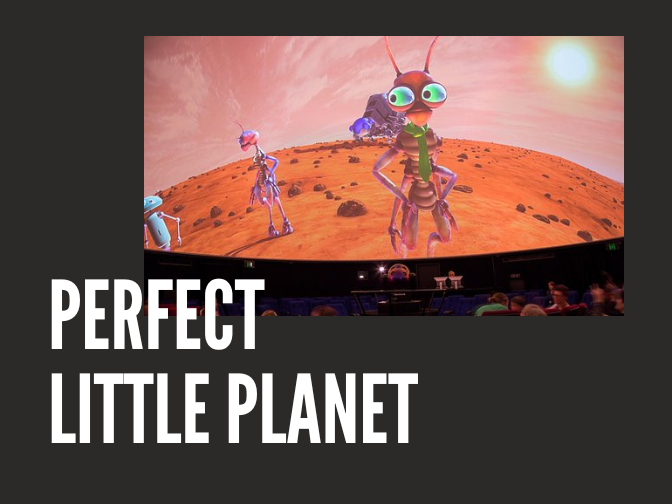 Photograph of a Planetarium Theatre screen showing several alien creatures on a dusty, red planet on a charcoal background. Text reads, "Perfect Little Planet".