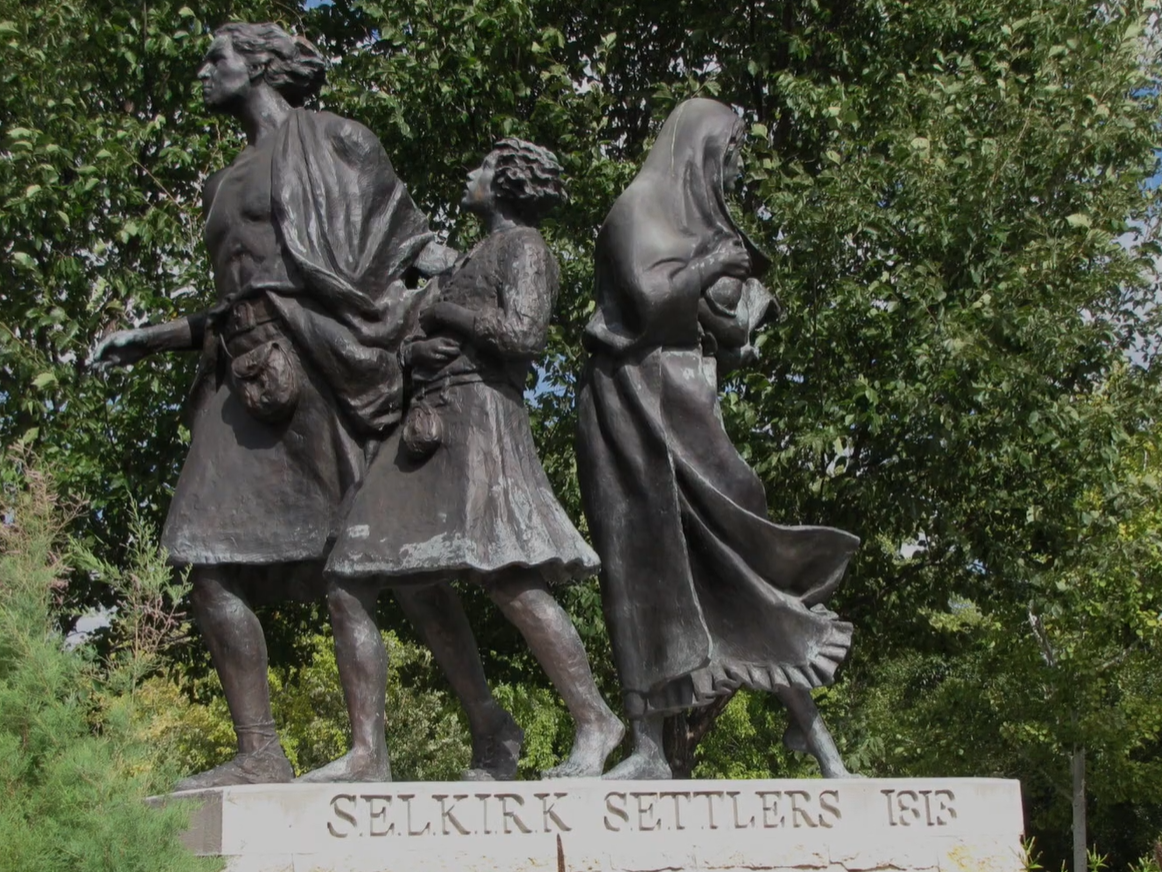 Bronze statue of Selkirk settlers.
