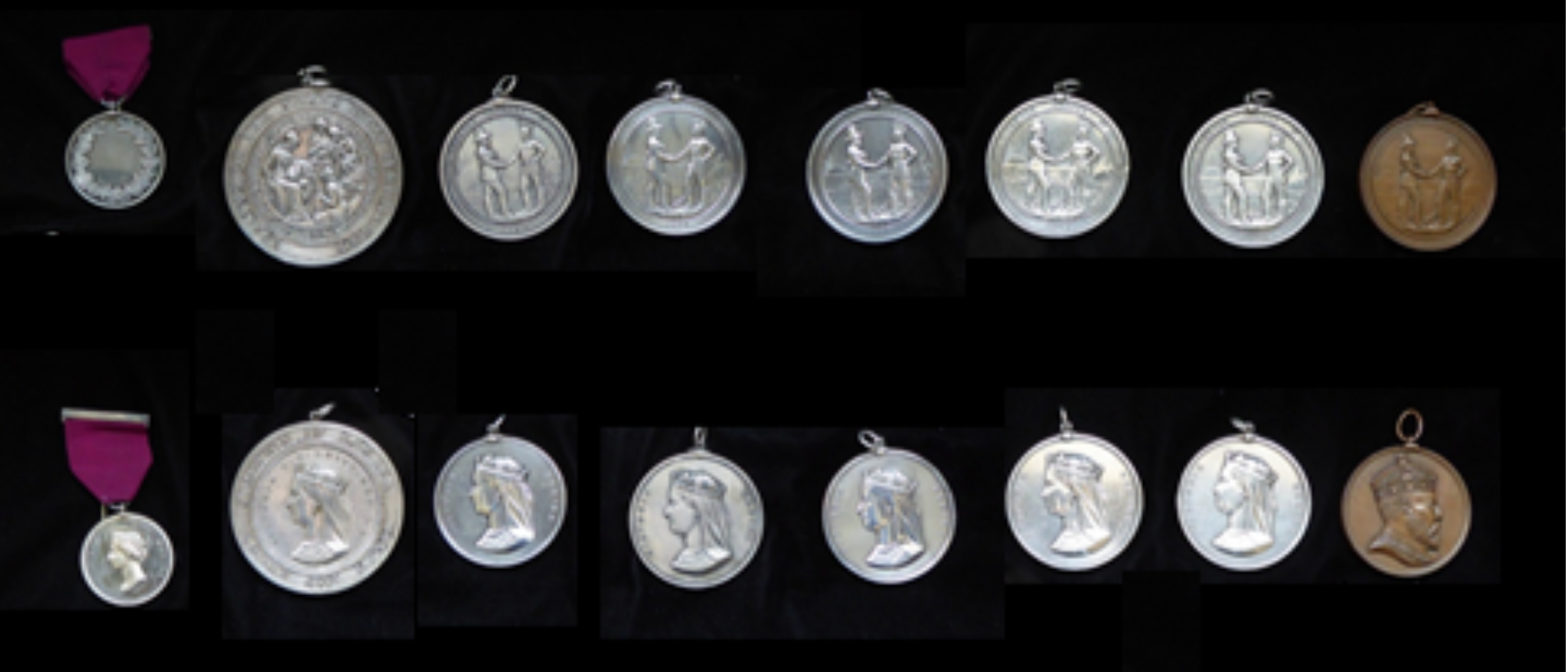 Photograph of eight Treaty Medals on a black background. Top row is the front of each medal, bottom row is the back of each medal.