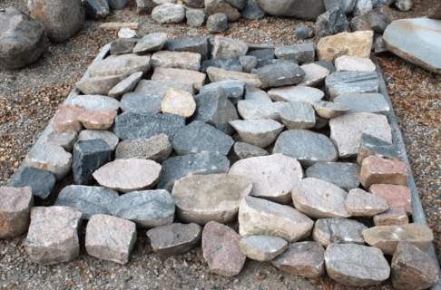 A selection of fieldstone blocks laid out together in a general square shape.
