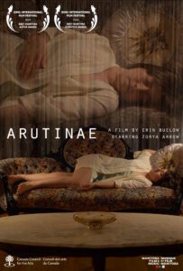 Film poster for "Arutinae". A young woman lies on her side on a floral patterns couch with a coffee table in front of her. There is a double exposure showing a closer view of her face above the full-body shot. In the lower left corner is the Canada Council for the Arts logo, and in the bottom right corner is the Manitoba Film and Arts logo. In the upper left corner are award notes designating Gimli International Film Festival 2023 for Best Manitoba Actor Award and Best Manitoba Director Award.