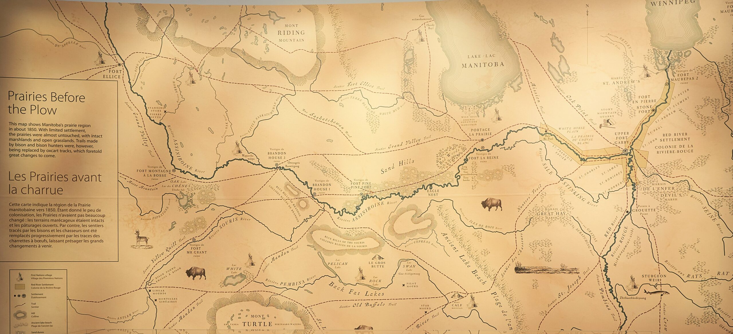 A close-up on an illustrated map of Manitoba, showing rivers and lakes.