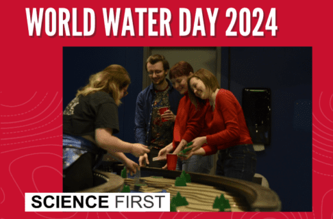 Photograph of four young adults engage with the water table exhibit together in the Manitoba Museum Science Gallery on a red background. Text along the top reads, "World Water Day 2024". In the bottom left corner is the Science First logo.