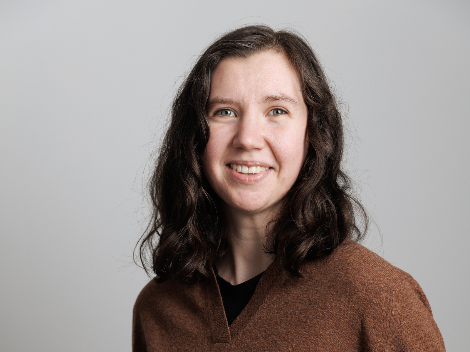 Formal headshot of Dr. Brigit Tronrud smiling at the camera.