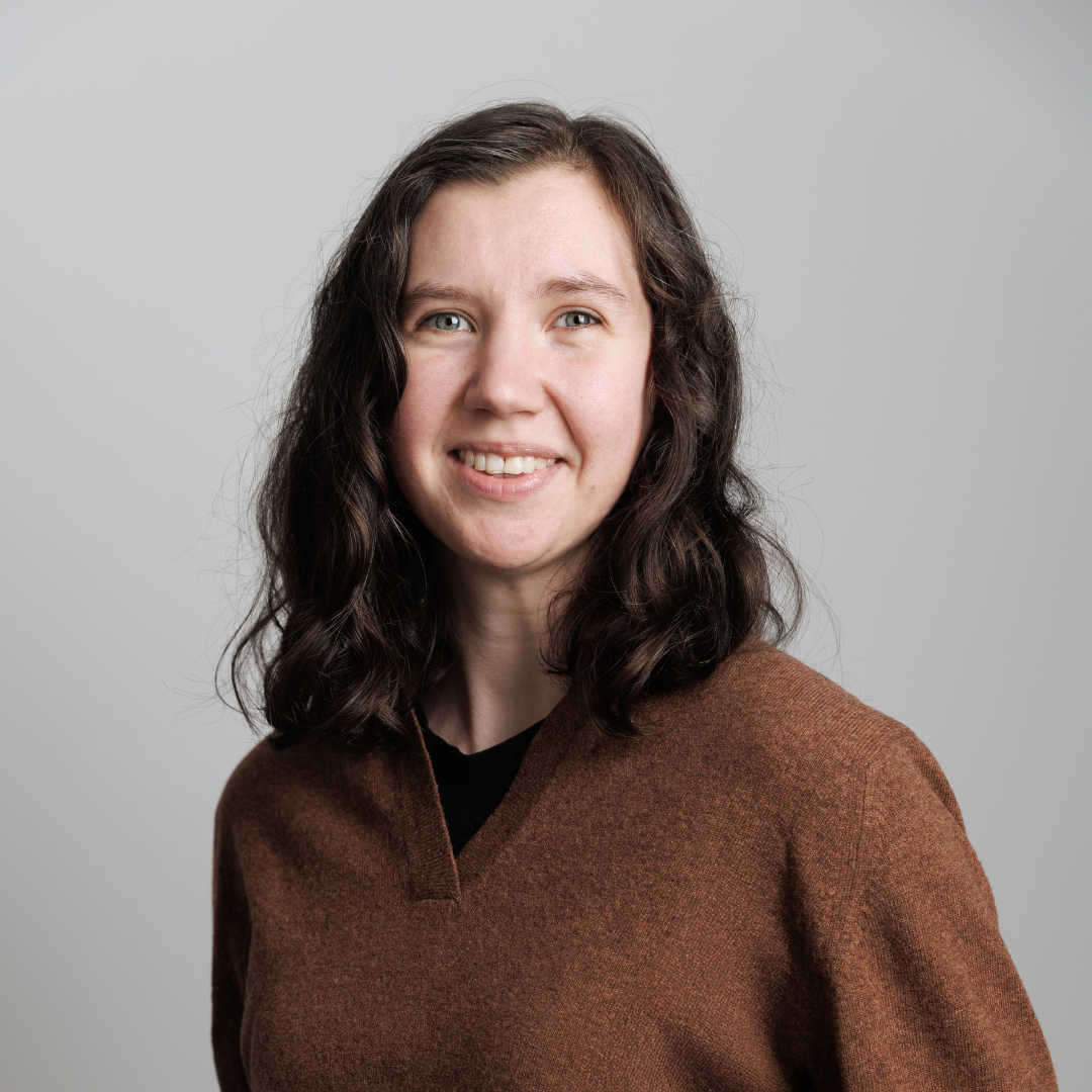 Formal headshot of Dr. Brigit Tronrud smiling at the camera.