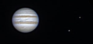 The planet Jupiter and two of its moons.