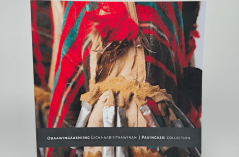 A book cover featuring a photograph of an Anishinaabe ceremonial artifact, with the title on the lower third, "Obaawingaashing Gichi-Aabijitaawinan | Pauingassi Collection".