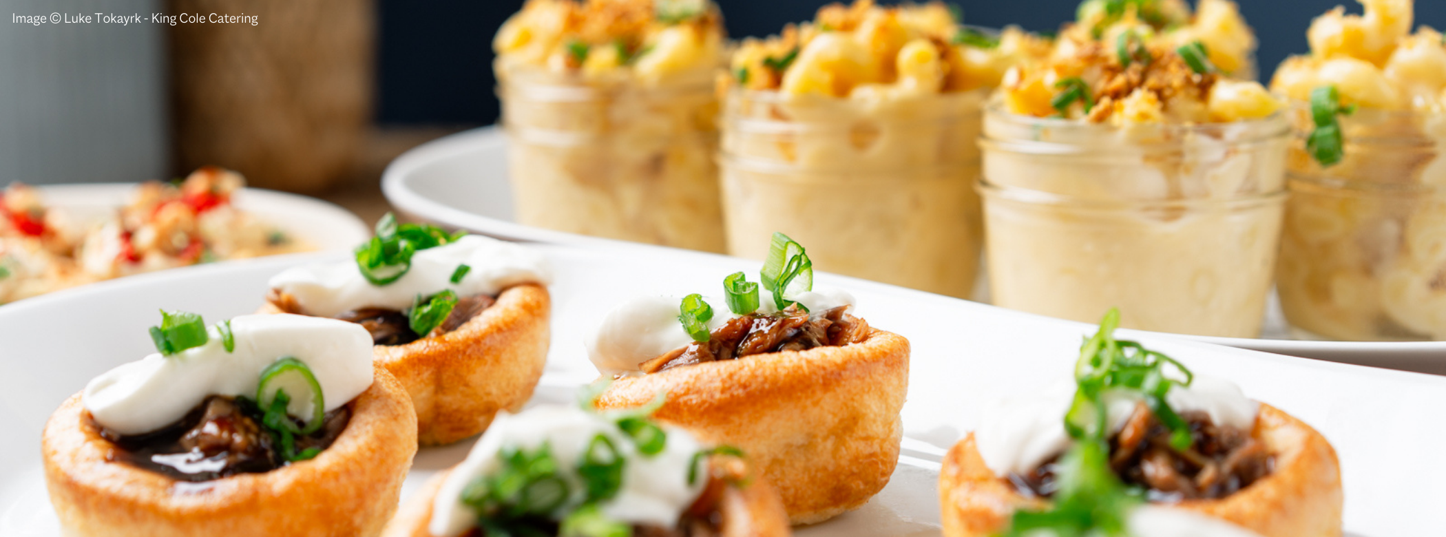 Photo of six savory tarts and macaroni cups.