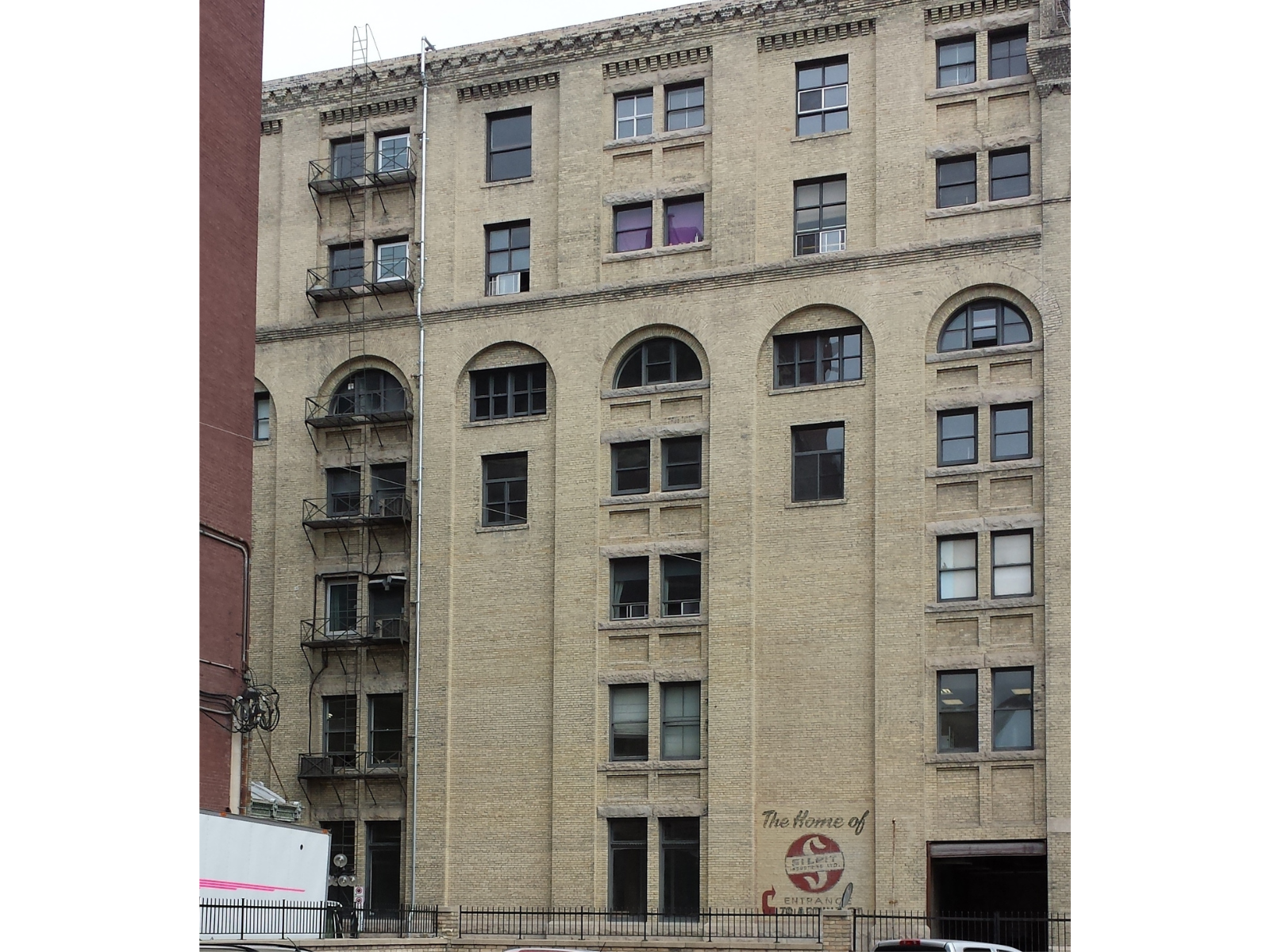 A seven-storey stone building with many windows.