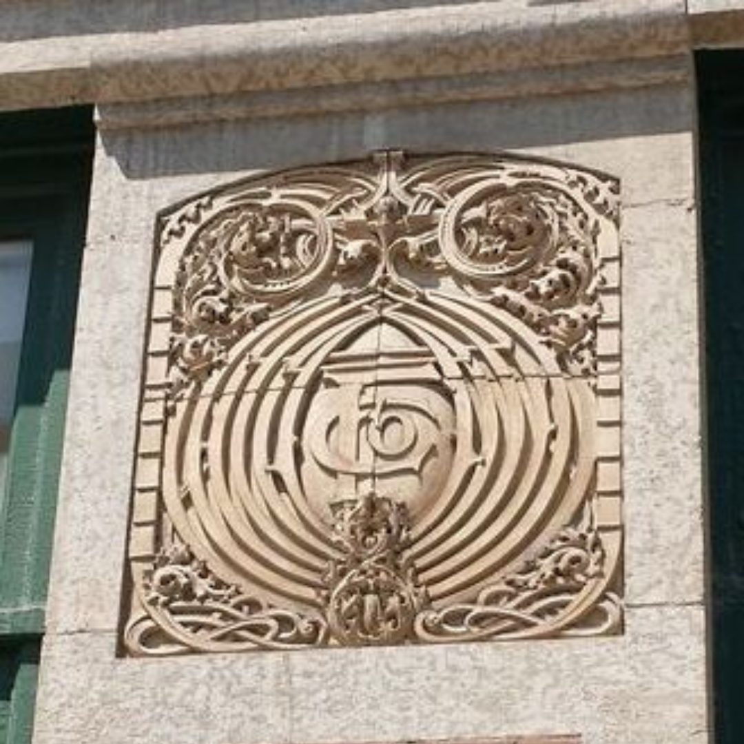 An ornamental wall decoration in a cream Terracotta design.