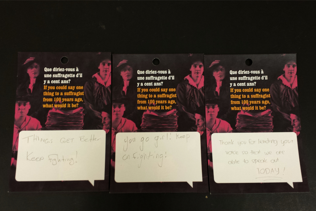 Three response cards with the question, "If you could say one thing to a suffragist from 100 years ago, what would it be?" The first reply says "Things get better keep fighting!", the next, "You go girl! keep on fighting!", and the last, "Thank you for leaning your voice so that we are able to speak out TODAY!"