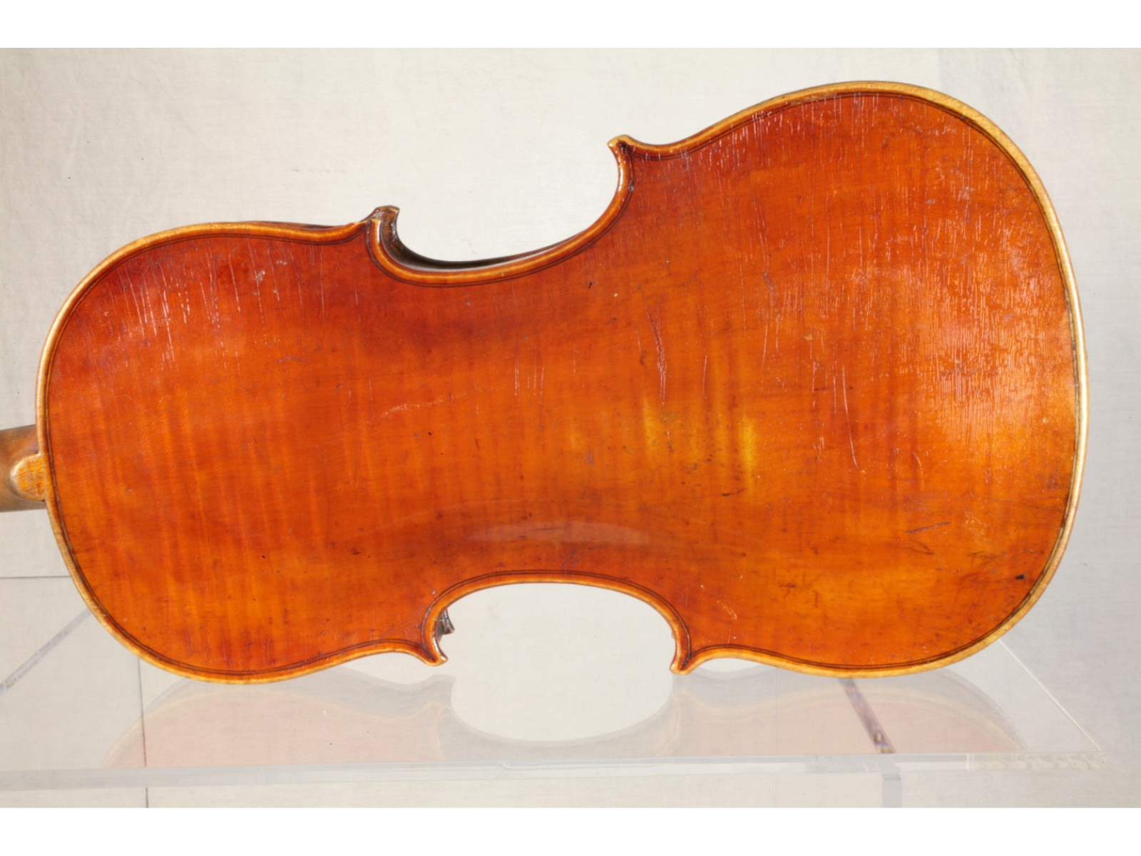 The back side of an orange-brown violin.