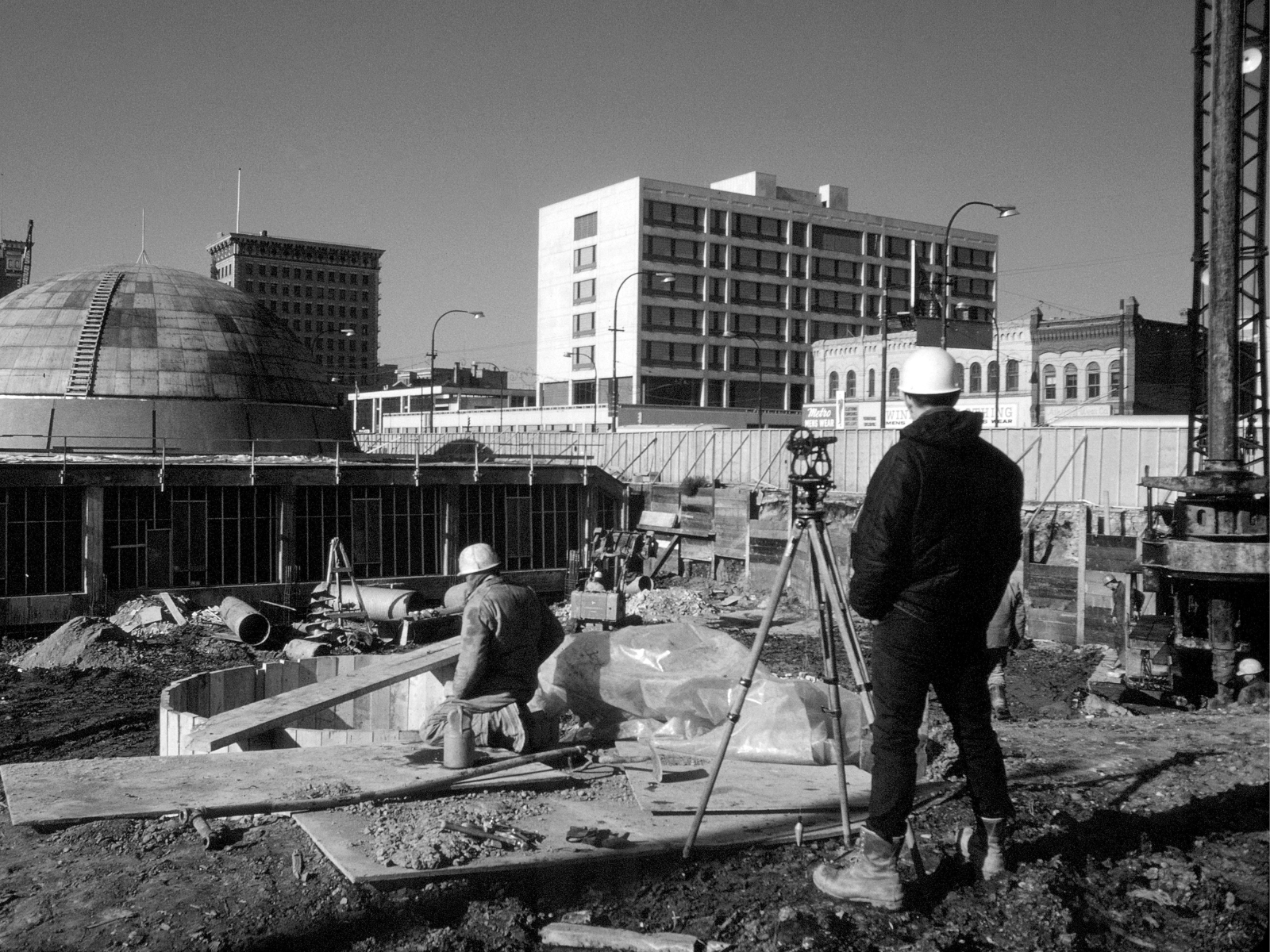 A black and white photo of the site of the Manitoba Museum and Planetarium while under construction.