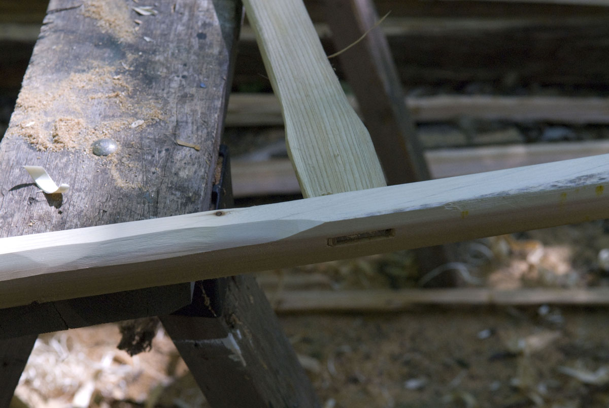 Close up on the joint of a canoe frame.