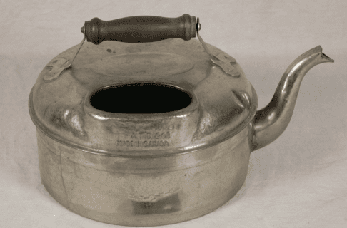 A large shiny silver kettle.