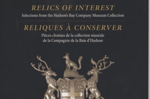 Close-up on a dark-coloured book cover with the Hudson's Bay Company crest in the centre. The title reads, "Relics of Interest: Selections from the Hudson’s Bay Company Museum Collection".