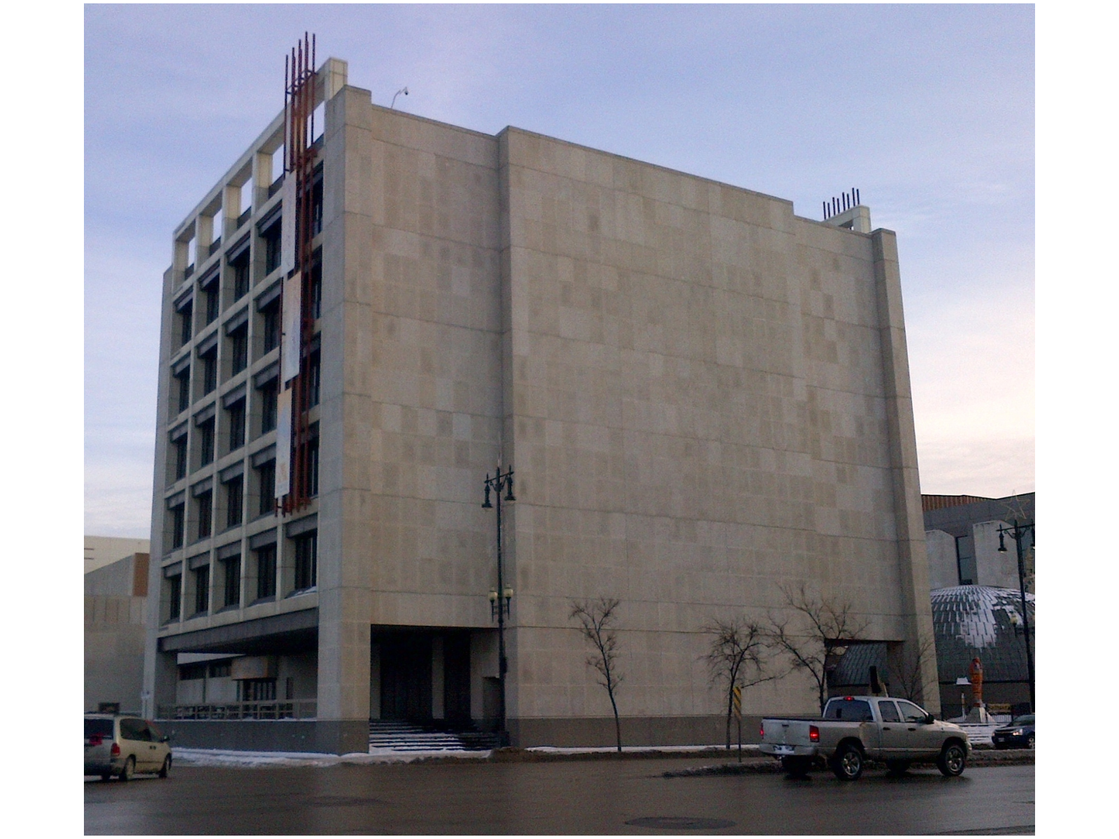 The Manitoba Museum from across the intersection of Rupert Avenue and Main Street. A multi-storey building built of Tyndall Stone.