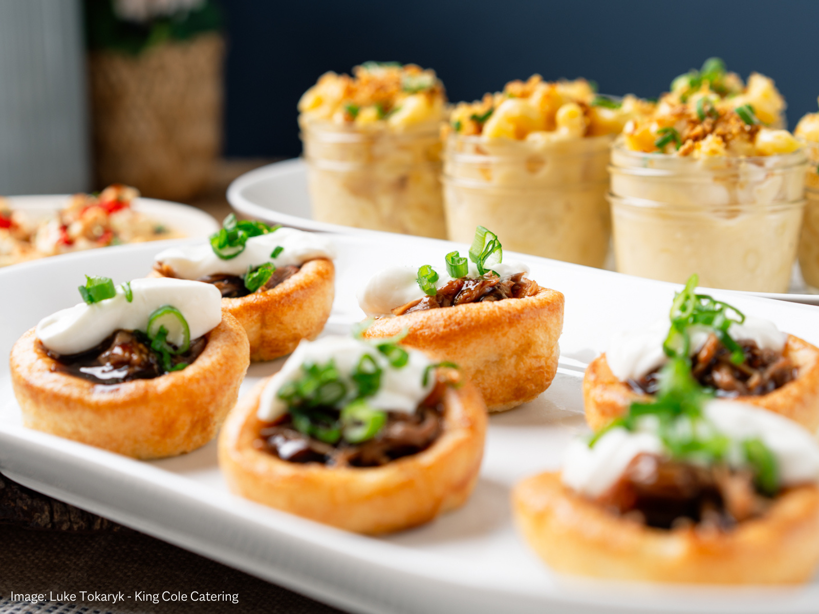 Photo of six tarts and macaroni cups.