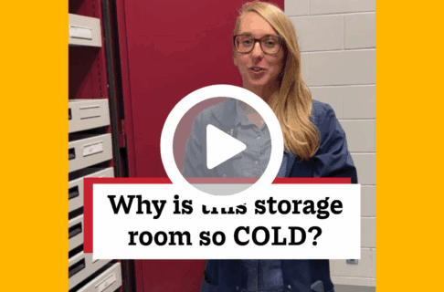 A screenshot of a video, an individual stands next to a storage unit with drawers of varying sizes. There's a play button over the screenshot and overlaid text reads, "Why is this storage room so COLD?".