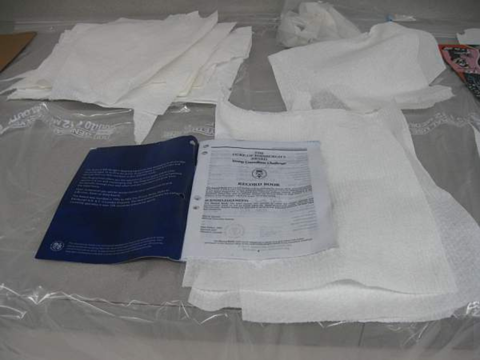A wet notebook with paper towels inserted between each page to aid in drying.