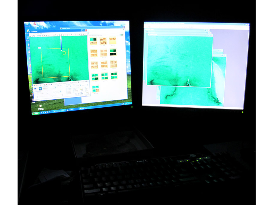 Close-up on two computer screens displaying images being picked up through the digital telescope.