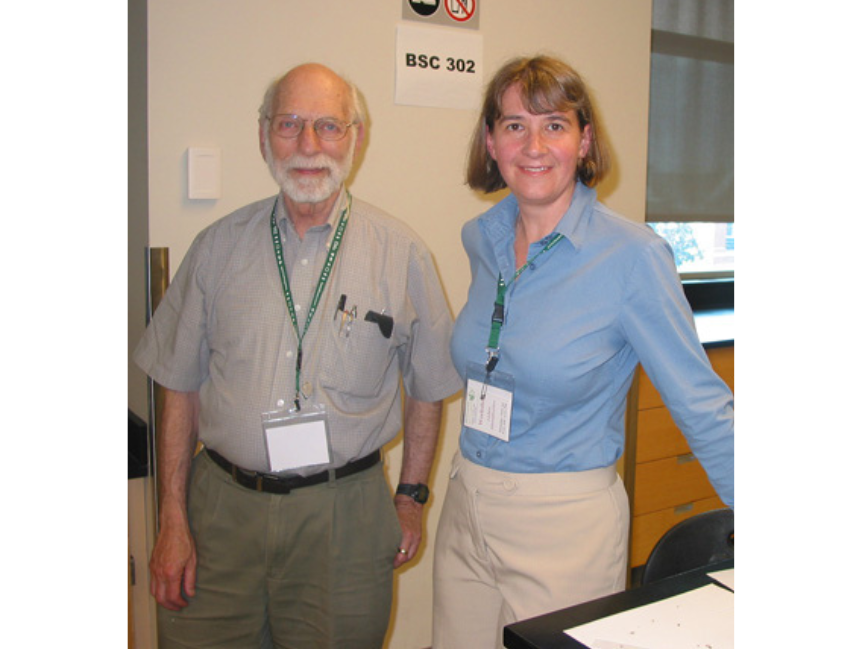 Dr. Diana Bizecki Robson posing for a photo with Dr. Brodo, an older gentleman.