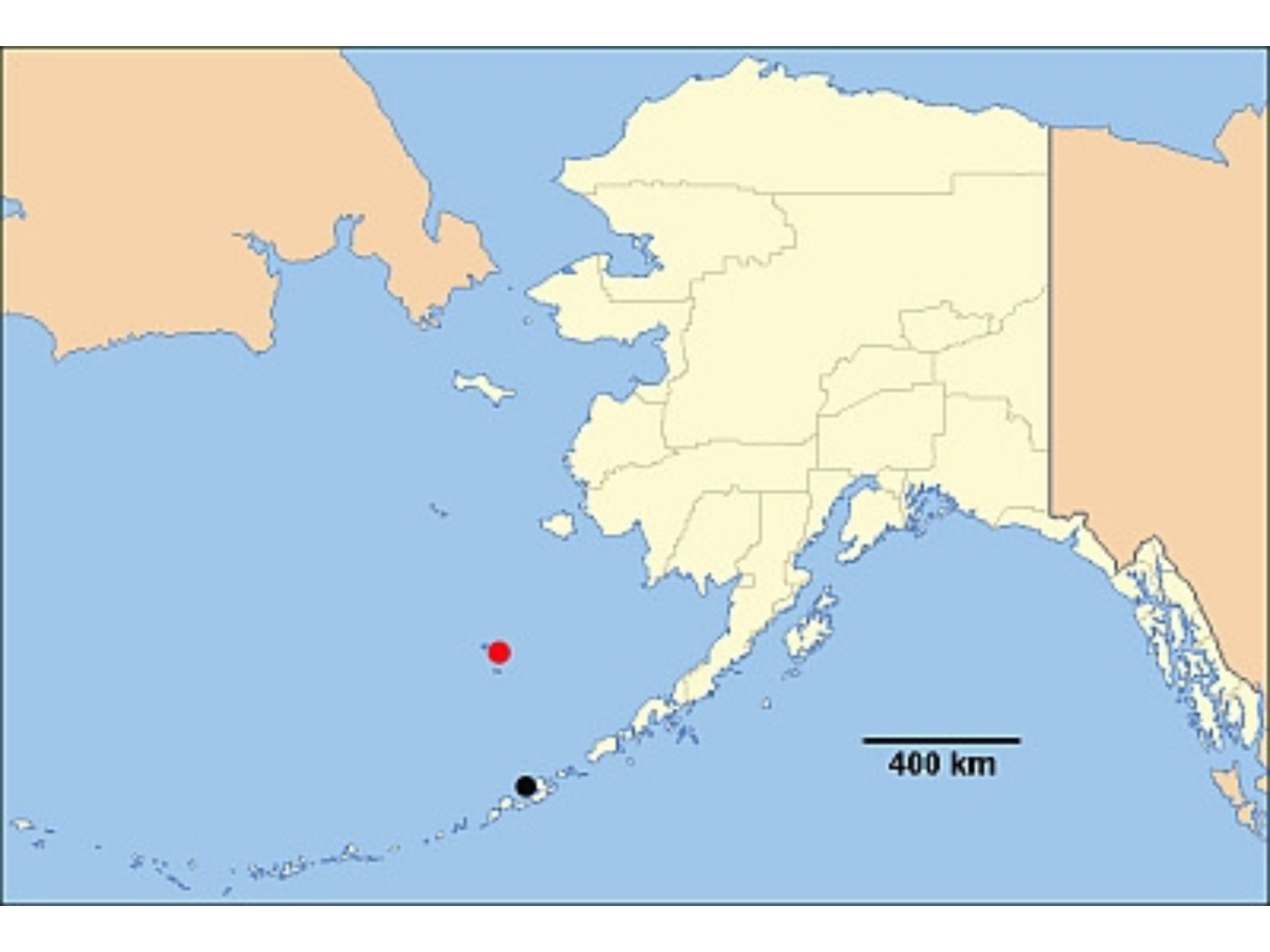 Close-up on a map of Alaska with red and black dots marking off particular islands off the coast.