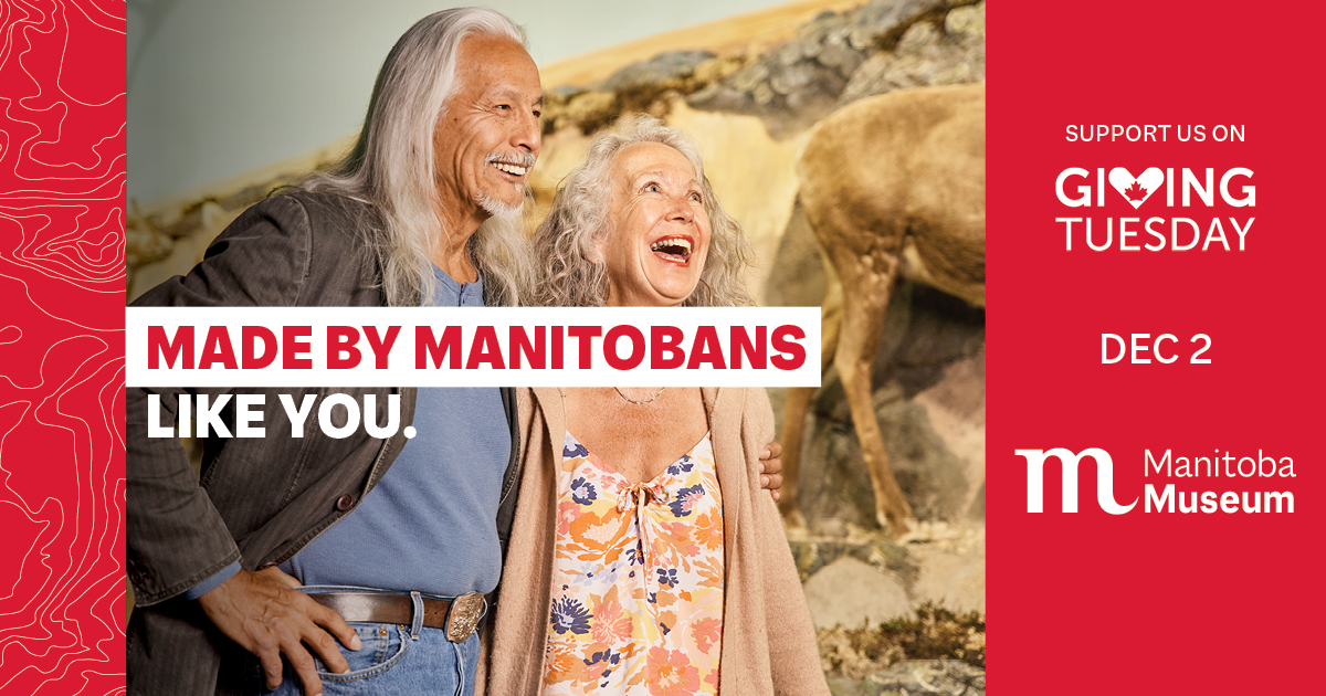 A photograph of two adults smiling and laughing together near the caribou diorama in the Arctic & Sub-Arctic Gallery of the Manitoba Museum. Text on the image reads, 