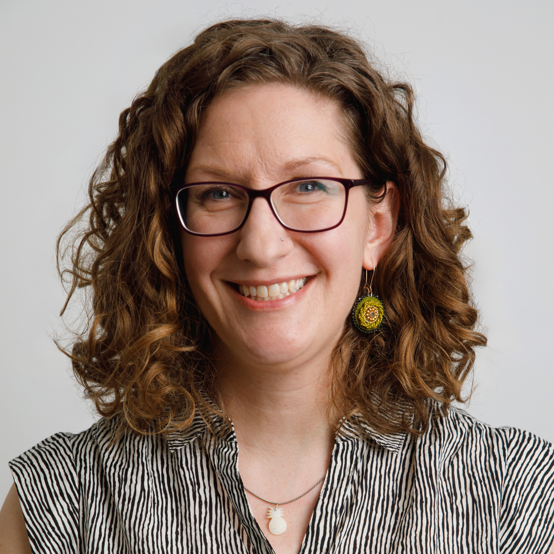 Formal headshot of Dr. Amelia Fay smiling at the camera.