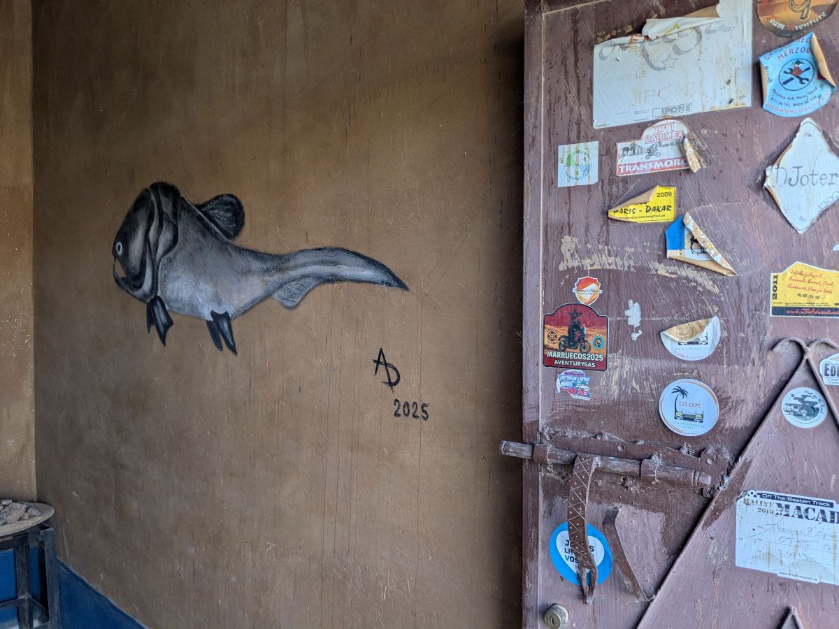 Painting of an ancient fish, Dunkleosteus, on an interior stone wall.